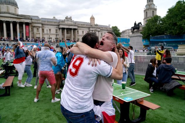 England fans celebrate as Shaw scores.