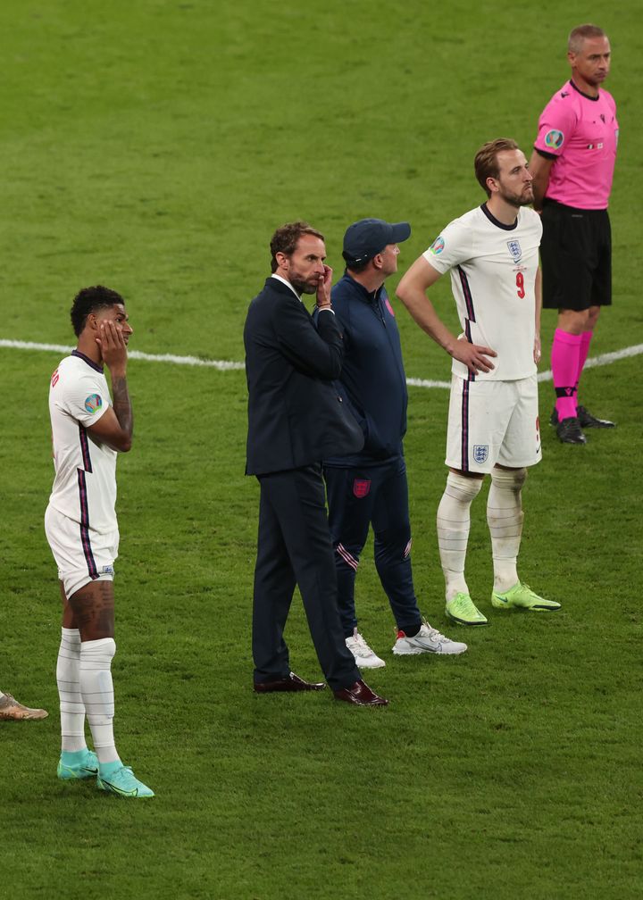 England coach Gareth Southgate with players Marcus Rashford and Harry Kane after Sunday night's game