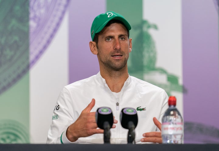 Novak Djokovic attends a press conference after winning his men's singles final match against Matteo Berrettini at Wimbledon