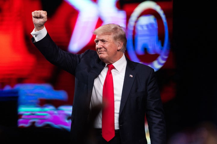 Former President Donald Trump pumps his fist as he walks off after speaking at the Conservative Political Action Conference (