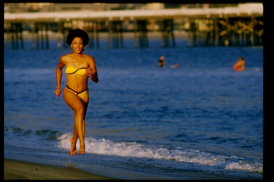 Griffith Joyner runs on the beach. 