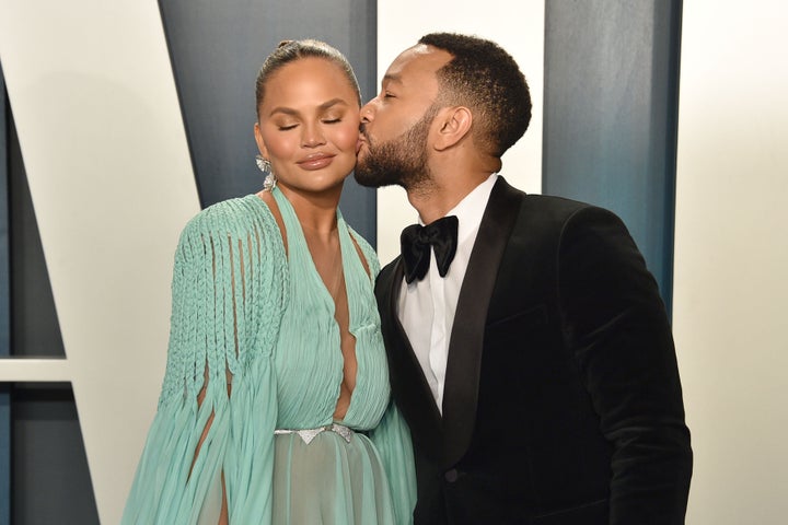 Chrissy Teigen with her husband, musician John Legend at the 2020 Vanity Fair Oscar Party.