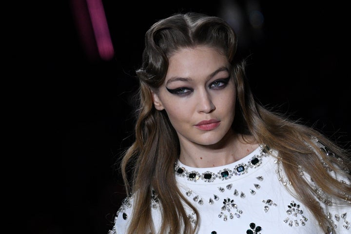 US model Gigi Hadid presents a creation for Miu Miu during the Women's Fall-Winter 2020-2021 Ready-to-Wear collection fashion