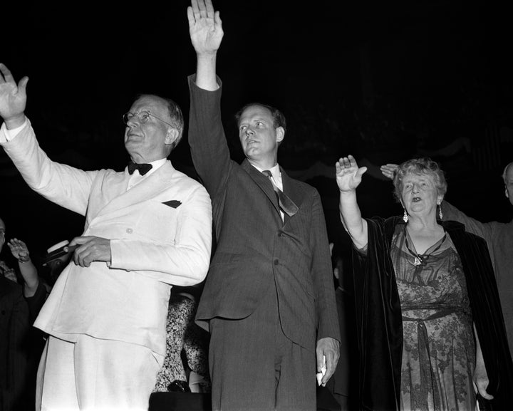 Sen. Burton K. Wheeler, left, aviator Charles Lindbergh and novelist Kathleen Norris pledge allegiance to the flag at an Amer