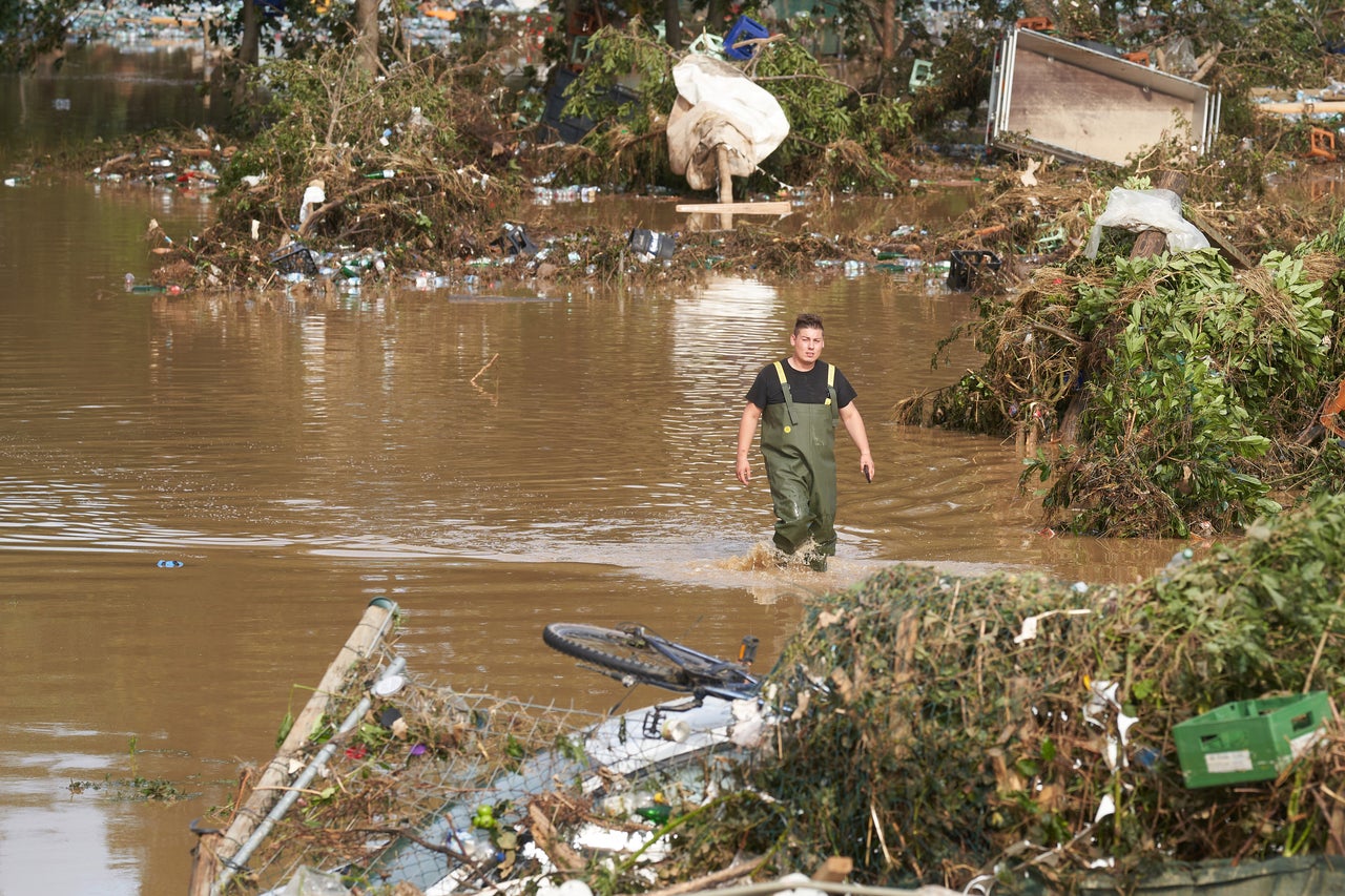 15 July 2021, Rhineland-Palatinate, Bad Neuenahr: A man walks through a flooded allotment. Heavy rain caused extreme flooding. Photo: Thomas Frey/dpa (Photo by Thomas Frey/picture alliance via Getty Images)