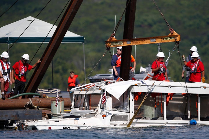 In this July 23, 2018 file photo, a duck boat that sank in Table Rock Lake in Branson, Mo., is raised after it went down the