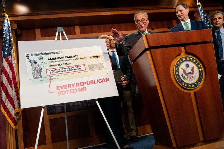 Senate Majority Leader Chuck Schumer (D-N.Y.), flanked by Senate Democrats, speaks during a press conference on the child tax credit on Thursday.