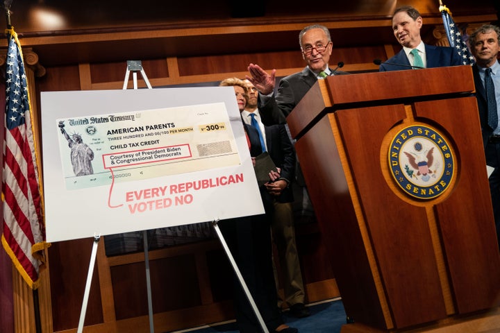 Senate Majority Leader Chuck Schumer (D-N.Y.), flanked by Senate Democrats, speaks during a press conference on the child tax credit on Thursday. 