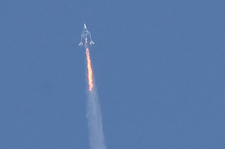 Virgin Galactic SpaceShipTwo Unity spacecraft and its mothership split up as they fly over Spaceport America, near Trut