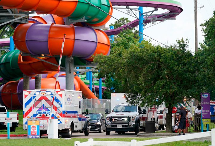 Emergency vehicles are seen near where people were treated for chemical irritants at Six Flags Hurricane Harbor Splashtown on Saturday.