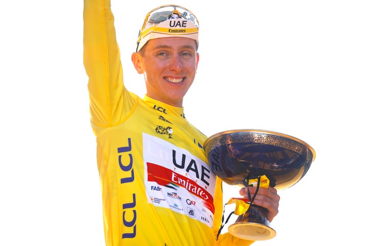 Tour de France winner Slovenia's Tadej Pogacar, wearing the overall leader's yellow jersey, celebrates after the twenty-first