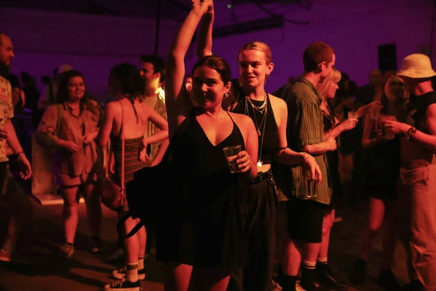 Revellers dance during the 