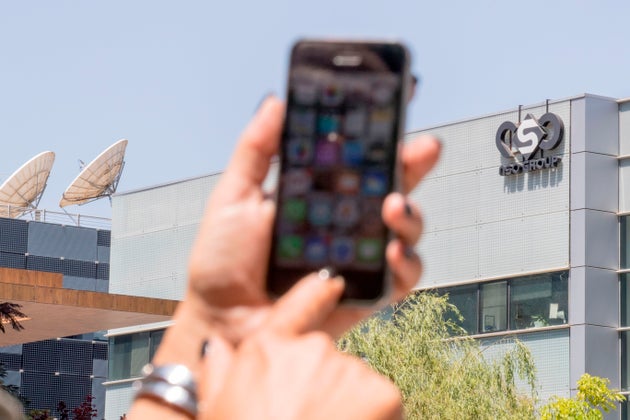 An Israeli woman uses her iPhone in front of the building housing the Israeli NSO group, on August 28, 2016, in Herzliya, near Tel Aviv. - Apple iPhone owners, earlier in the week, were urged to install a quickly released security update after a sophisticated attack on an Emirati dissident exposed vulnerabilities targeted by cyber arms dealers.
Lookout and Citizen Lab worked with Apple on an iOS patch to defend against what was called 