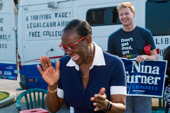 Nina Turner speaks with supporters before casting her vote in Cleveland on July 7. Turner, a progressive firebrand, is emphasizing her local roots ahead of the Aug. 3 primary race.