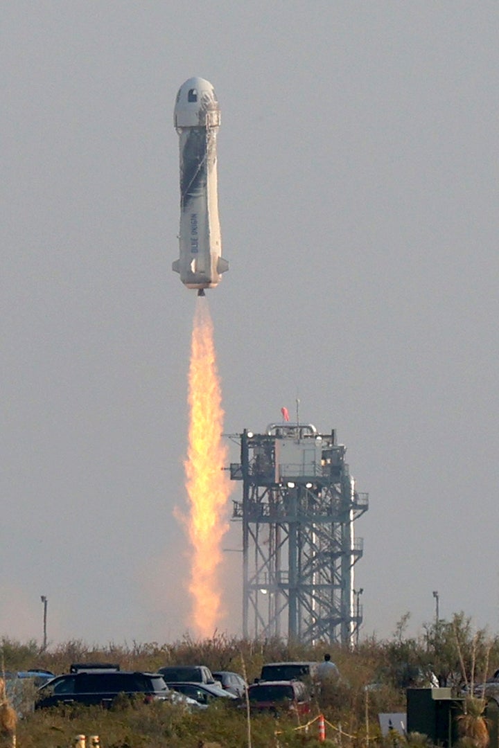 The New Shepard Blue Origin rocket lifts-off from the launch pad carrying Jeff Bezos, his brother Mark Bezos, 18-year-old Oliver Daemen, and 82-year-old Wally Funk.