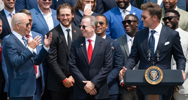 President Joe Biden interacts with Tom Brady and his teammates during a ceremony honoring the Tampa Bay Buccaneers for their Super Bowl LV win on July 20, 2021. 
