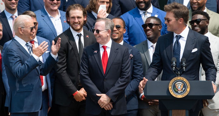 President Joe Biden interacts with Tom Brady and his teammates during a ceremony honoring the Tampa Bay Buccaneers for their Super Bowl LV win on July 20, 2021. 