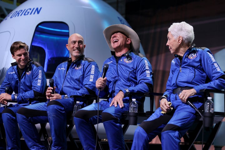 Blue Origin’s New Shepard crew (L-R) Oliver Daemen, Mark Bezos, Jeff Bezos, and Wally Funk hold a press conference after their fight Tuesday.