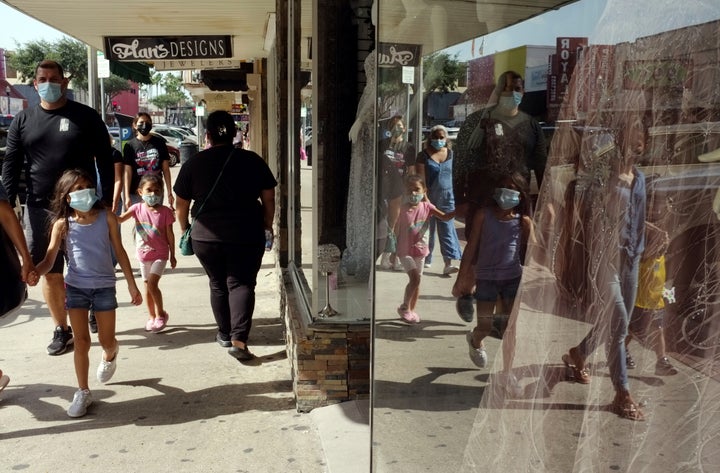 Shoppers are seen wearing masks in downtown McAllen, Texas, on July 16. Much of the worsening problem with cases is being driven by the delta variant first identified in India, that has since hit the United Kingdom and other countries.