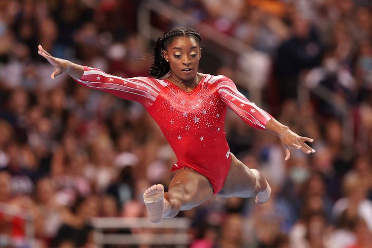 Simone Biles competes in the floor exercise during the women's competition of the 2021 U.S. Gymnastics Olympic Trials at America’s Center on June 27, 2021, in St. Louis.