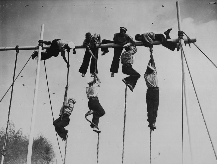 12th September 1934: Sailors from the training ship 'Warspite', climbing ropes during their sports day at Grays, Essex. (Photo by E. Dean/Topical Press Agency/Getty Images)