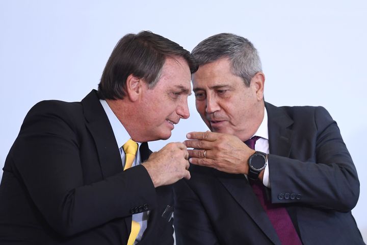 Brazilian Minister of Defense Walter Braga Netto, an Army general, told congressional leaders that there would be no elections in 2022 if changes that President Jair Bolsonaro (left) wants aren't made to the country's electronic voting system, according to a report from a major Brazilian newspaper.