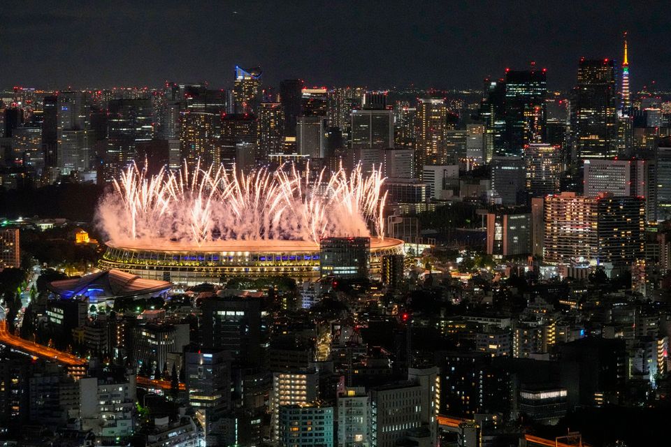 Fireworks illuminate over the National Stadium during the Tokyo Olympics opening