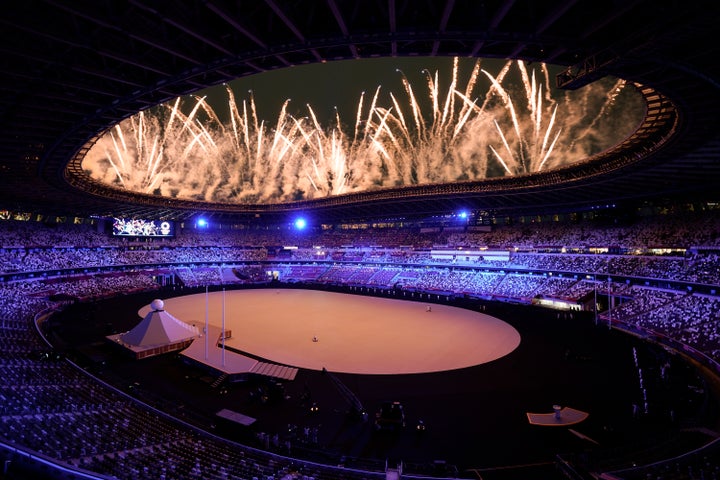 Fireworks go off at the start of the opening ceremony in the Olympic Stadium at the 2020 Summer Olympics, on July 23, 2021, i