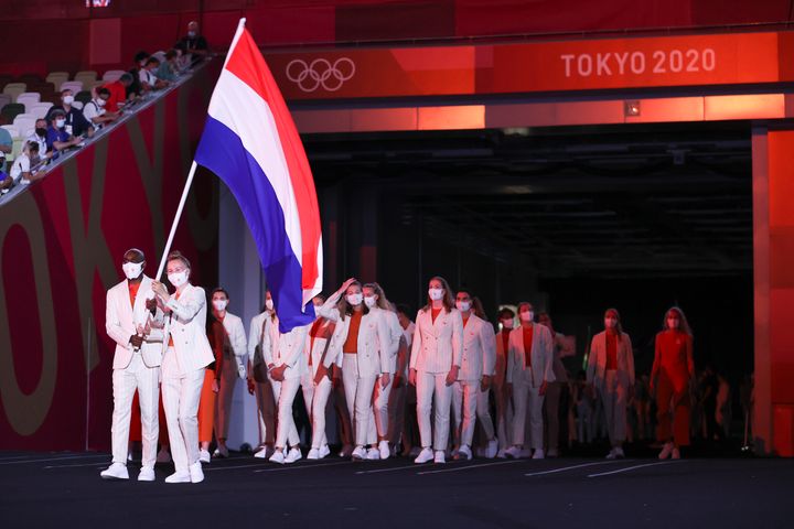 TOKYO, JAPAN - JULY 23: Flag bearers Keet Oldenbeuving and Churandy Martina of Team Netherlands lead their team during the Opening Ceremony of the Tokyo 2020 Olympic Games at Olympic Stadium on July 23, 2021 in Tokyo, Japan. (Photo by Jamie Squire/Getty Images)