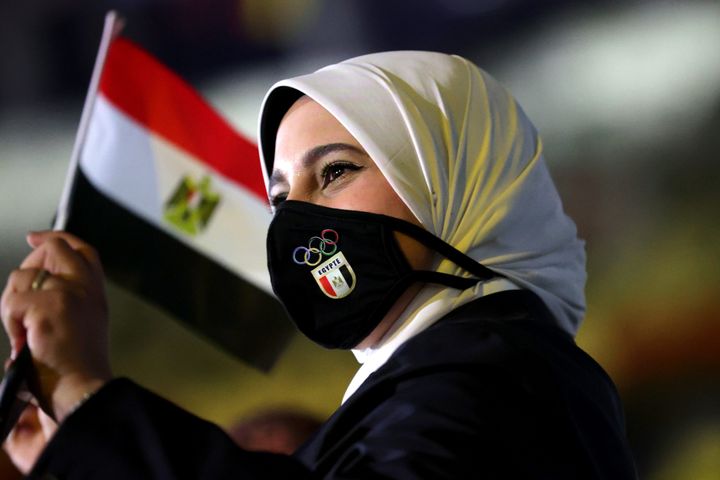 TOKYO, JAPAN - JULY 23: A member of Team Egypt waves a flag during the Opening Ceremony of the Tokyo 2020 Olympic Games at Olympic Stadium on July 23, 2021 in Tokyo, Japan. (Photo by Hannah McKay - Pool/Getty Images)