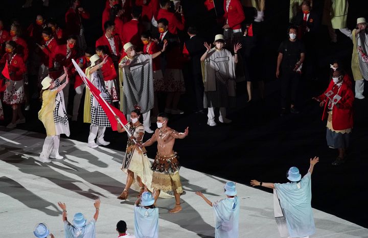 The Tonga Olympic team with Malia Paseka and Pita Taufatofua during the opening ceremony of the Tokyo 2020 Olympic Games at the Olympic Stadium in Japan. Picture date: Friday July 23, 2021. (Photo by Mike Egerton/PA Images via Getty Images)