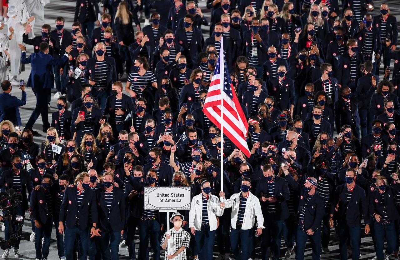 Team USA flagbearers Sue Bird and Eddy Alvares.