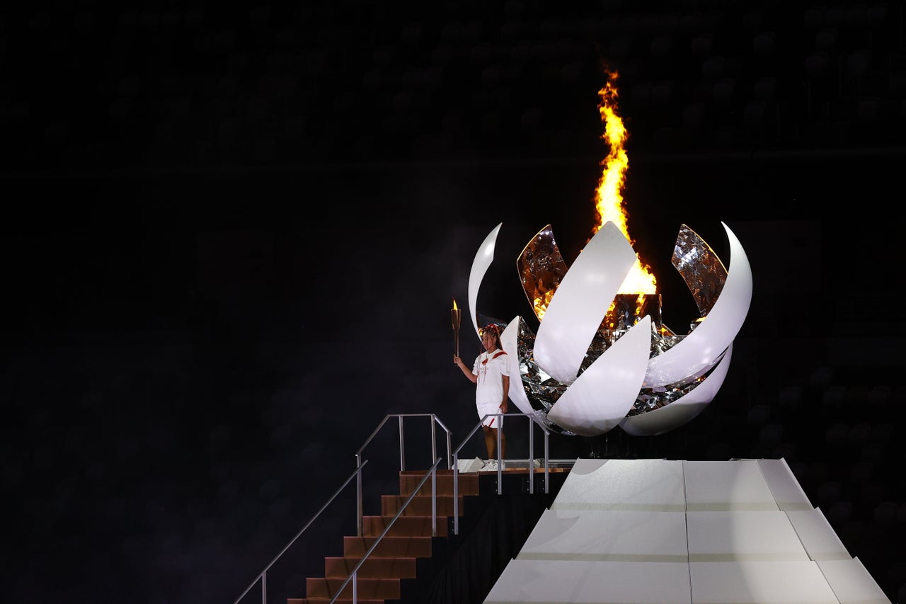 The Olympic Cauldron is lit.