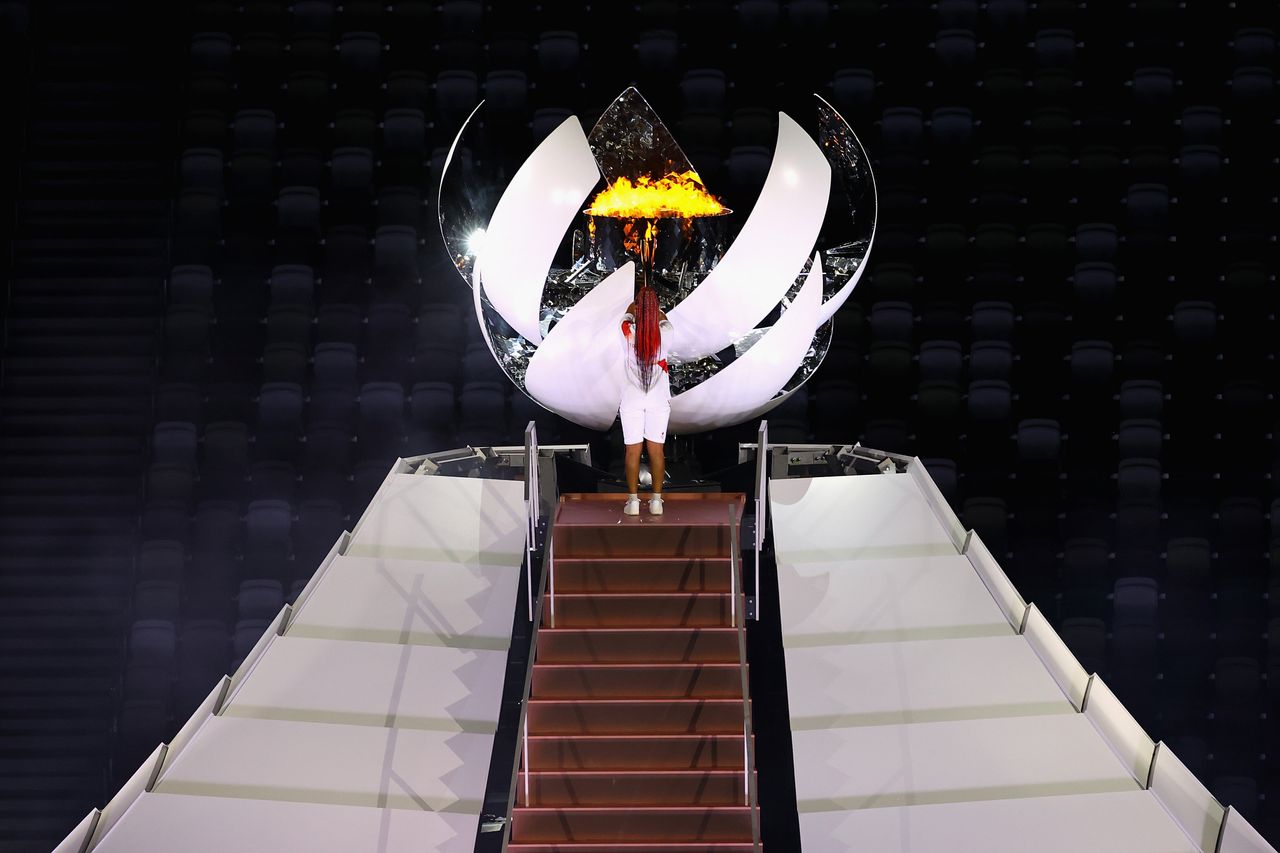 Naomi Osaka of Team Japan lights the Olympic cauldron. 