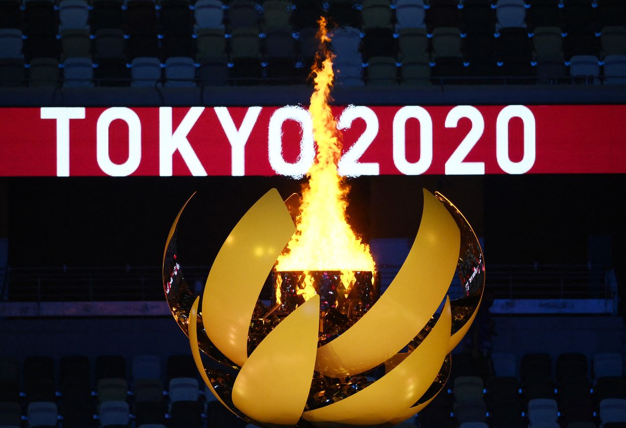 The Olympic Flame burns. 