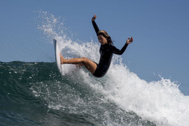 Japan's Mahina Maedagoes rides a wave during a free training session at the Tsurigasaki Surfing Beach, in Chiba, on July 24, 2021 during the Tokyo 2020 Olympic Games. 