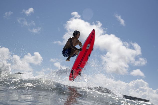 Japan's Kanoa Igarashi rides a wave during a free training session at the Tsurigasaki Surfing Beach.
