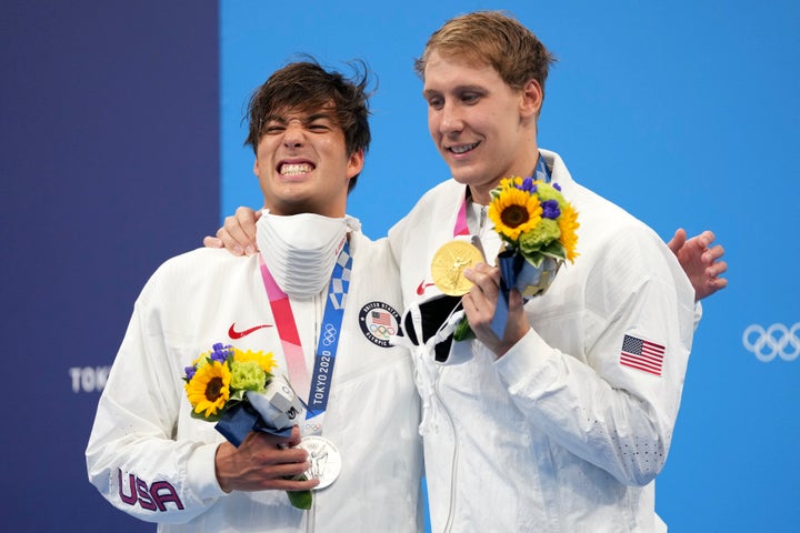 Gold medalist Chase Kalisz, (right) celebrates on the podium with silver medalist and teammate Jay Litherland after winning the men's 400-meter individual medley at the 2020 Summer Olympics.