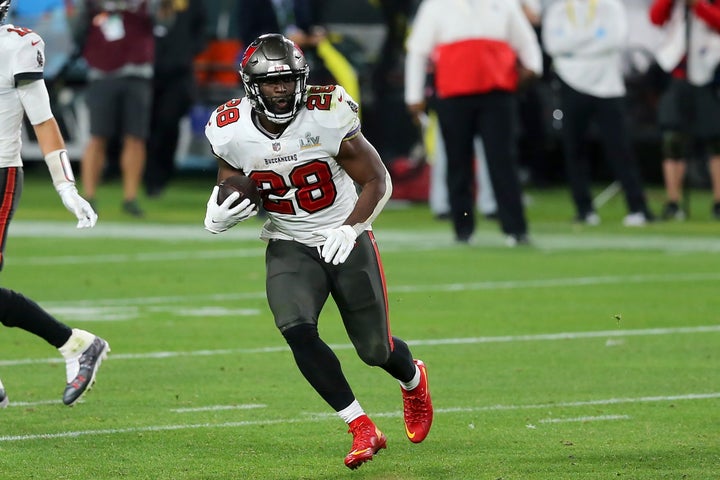 Leonard Fournette, pictured carrying the ball during the Super Bowl in February, is one of several NFL players refusing to be vaccinated.