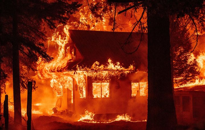 A home burns as the Dixie fire rips through the Indian Falls neighborhood of unincorporated Plumas County, California, on July 24.
