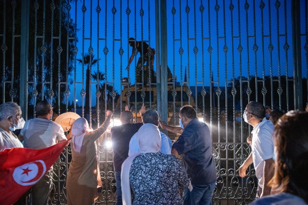 TUNIS, TUNISIA - JULY 26: Security forces take security measures around parliament building as supporters of Ennahda Movement stage protest against suspending parliament, assuming executive powers by Tunisian President Kais Saied in Tunis, Tunisia on July 26, 2021. Tunisian President Kais Saied announced late Sunday that he has fully assumed executive authority in addition to suspending parliament. (Photo by Nacer Talel/Anadolu Agency via Getty Images)