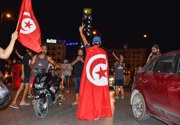 TUNIS, TUNISIA - 2021/07/25: People celebrate on the street after the Tunisian President Kais Saied announced the dissolution of parliament and Prime Minister Hichem Mechichi's government in Tunis.
After a day of a nationwide protest the Tunisian President Kais Saied announced the suspension of the country's parliament and the dismissal of Prime Minister Hichem Mechichi following a day of protests against the ruling party. (Photo by Jdidi Wassim/SOPA Images/LightRocket via Getty Images)