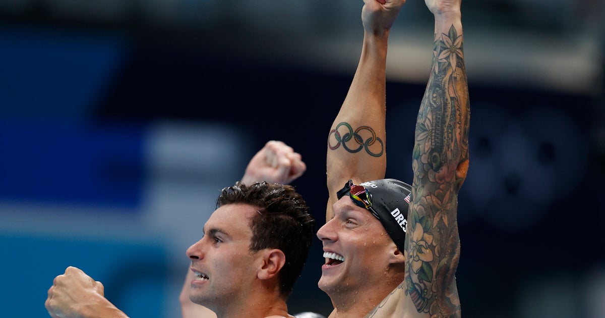 Caeleb Dressel Tosses Gold Medal To U.S. Sub Brooks Curry After Olympic Relay Victory