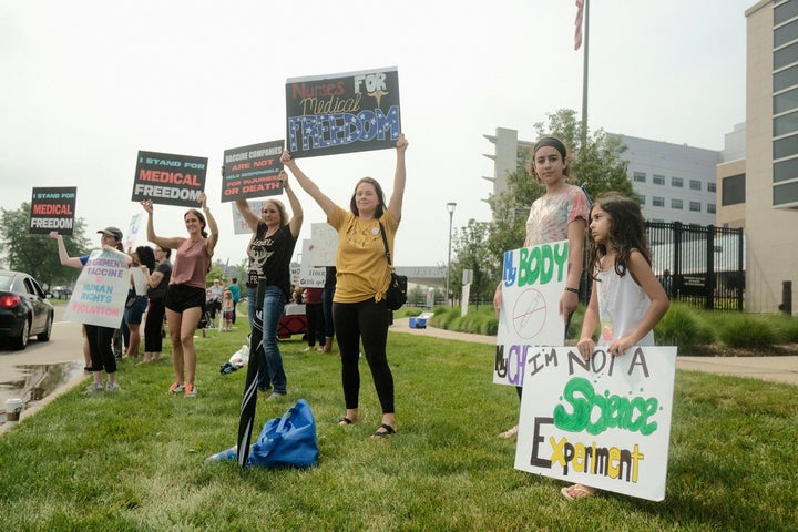 Protesters demonstrate against vaccine mandates for hospital workers outside Michigan's St. Joseph Mercy Oakland Hospital.