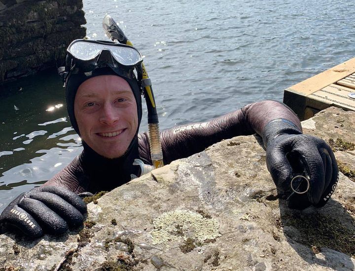 Lake District Divers volunteer Angus Hosking with Mick Balchin's wedding ring