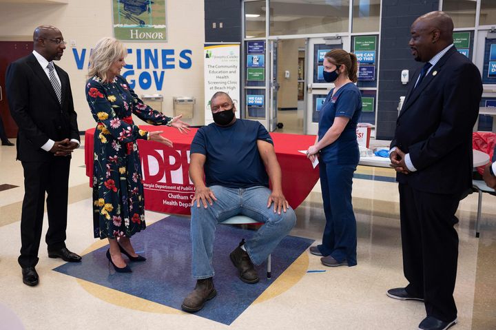 First lady Jill Biden is seen at a vaccination facility in Savannah, Georgia, on July 8, as Alfred Lee Smith (C) was vaccinated with the Johnson & Johnson COVID-19 vaccination.