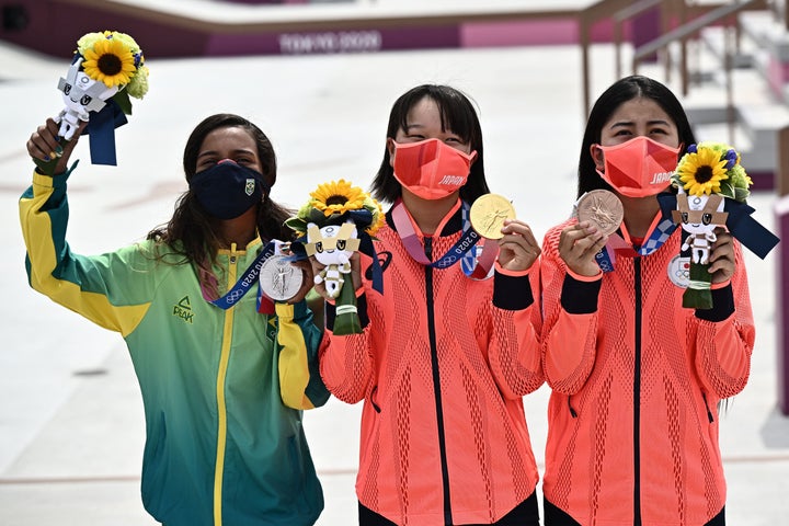 Brazil's Rayssa Leal (silver), Japan's Momiji Nishiya (gold), and Japan's Funa Nakayama (bronze) pose during the medal ceremony.