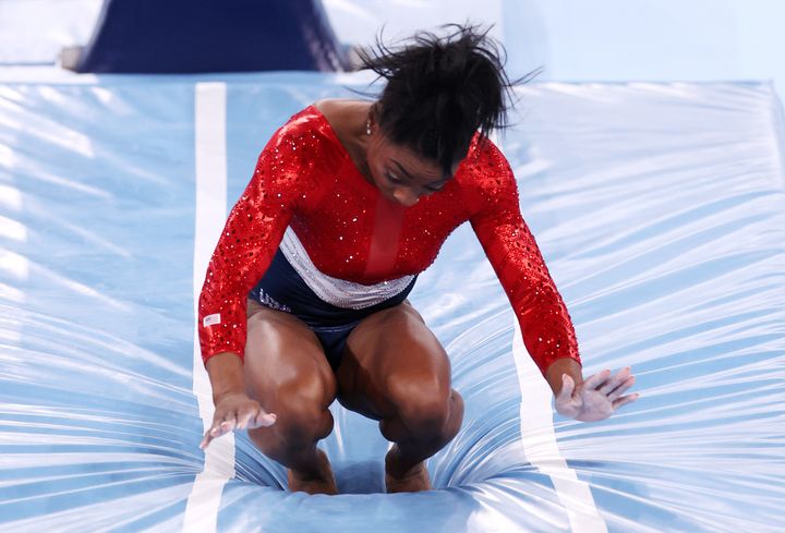 Simone Biles stumbles upon landing after competing in vault during the Women's Team Final on day four of the Tokyo 2020 Olympic Games at Ariake Gymnastics Centre on July 27.