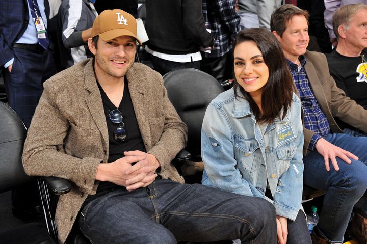 Ashton Kutcher and Mila Kunis at a basketball game in 2019.