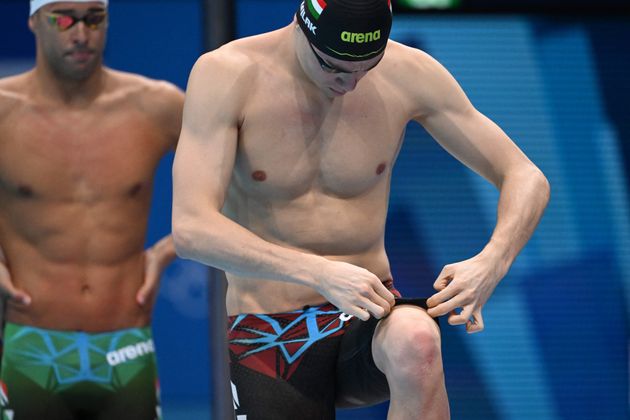 Kristof Milak adjusts his swim trunks ahead of the final of the men's 200-meter butterfly final at the Tokyo Olympics.